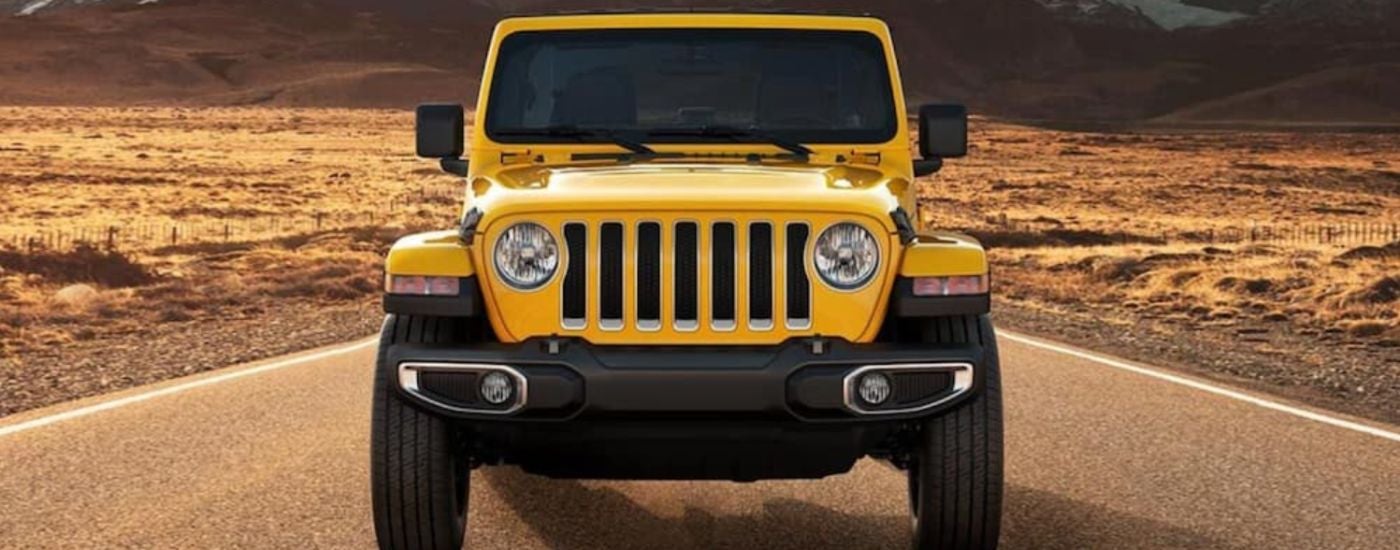 Head-on view of a yellow 2021 Jeep Wrangler.