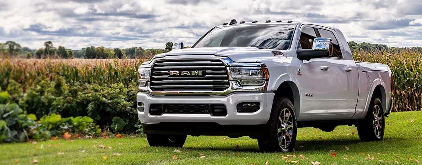 White 2024 Ram 2500 parked by a corn field