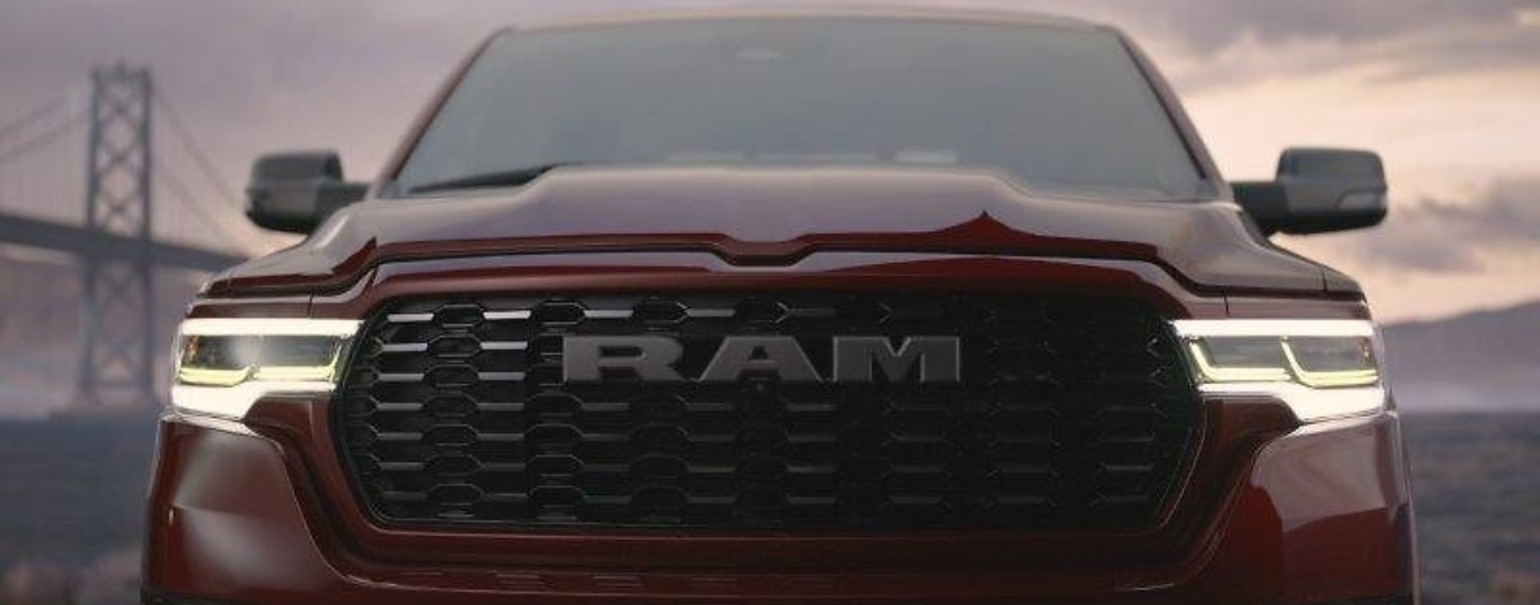 Close up of the front end of a red 2026 Ram 1500