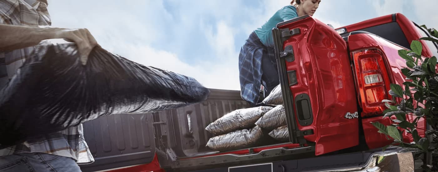 Bags in the bed of a red 2025 Ram 1500 Big Horn