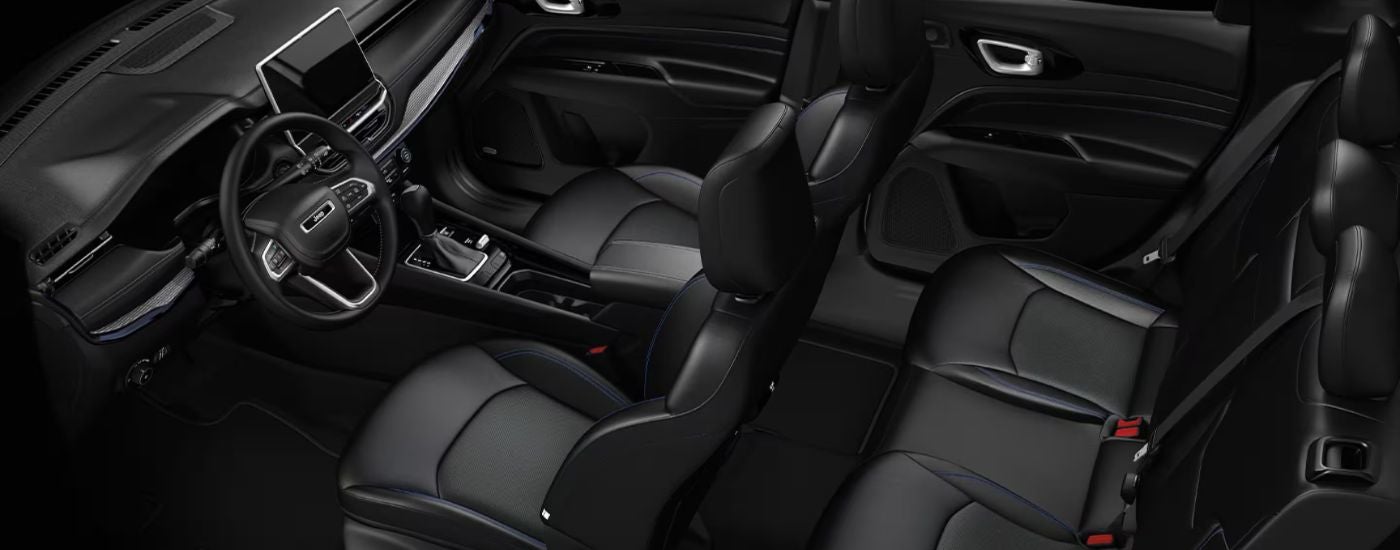 The black interior of a 2026 Jeep Compass.