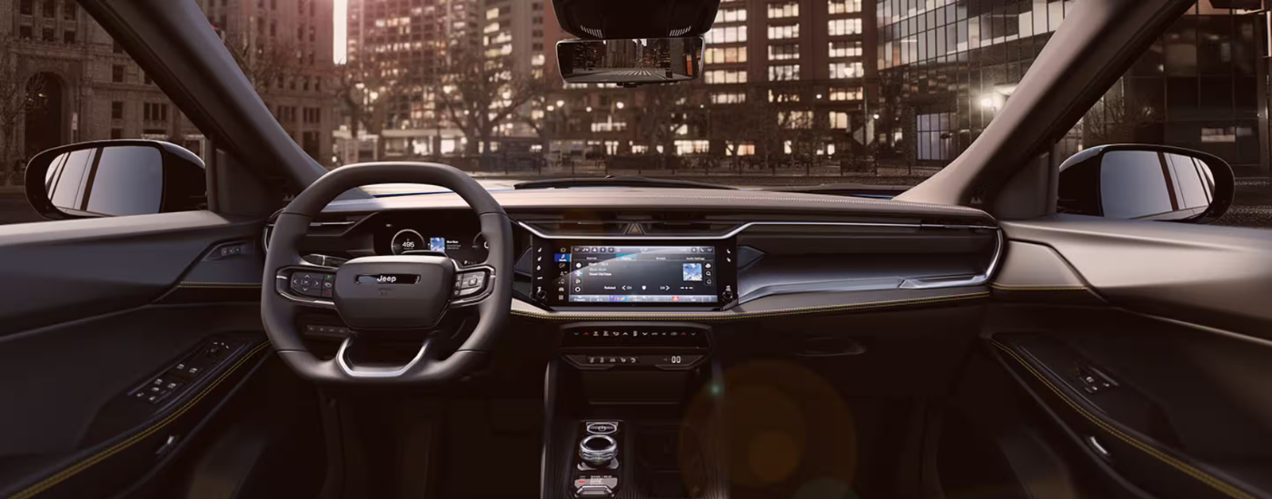 Black interior of a 2026 Jeep Cherokee parked in a city
