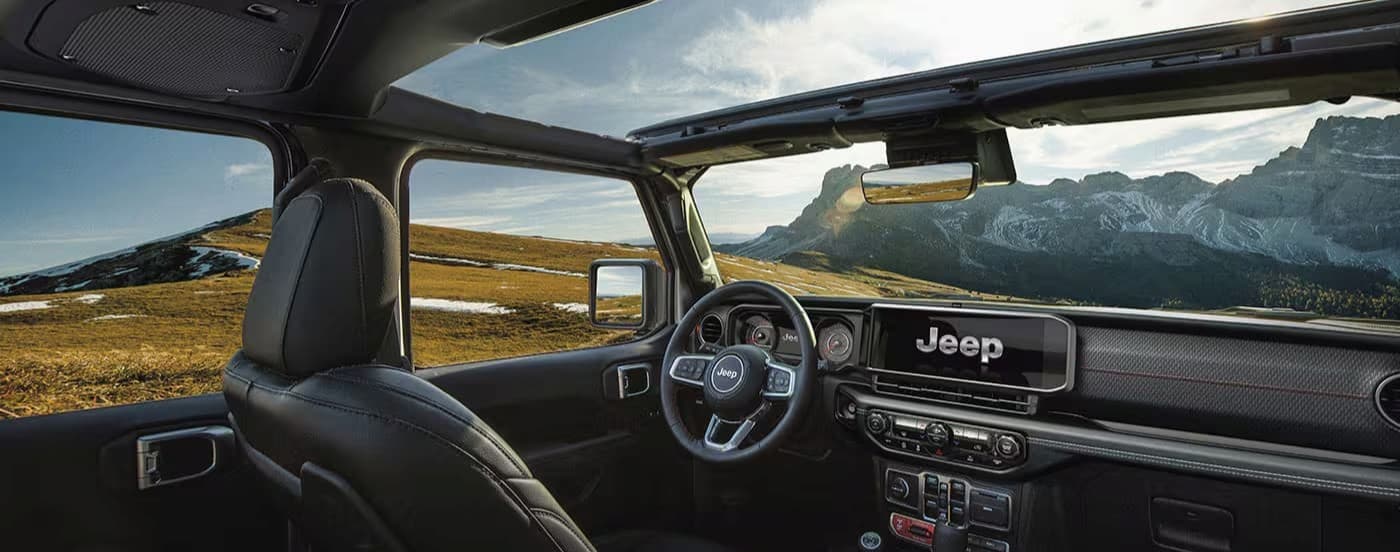 The black interior and dash in a 2026 Jeep Wrangler Rubicon.