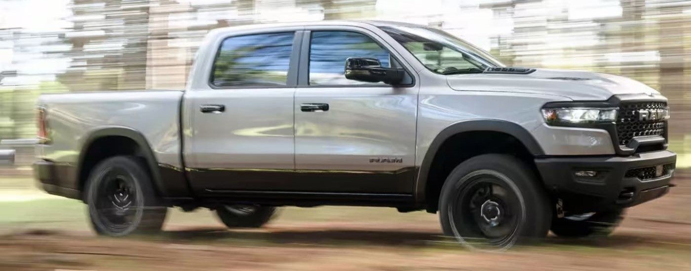 A silver 2025 Ram 1500 off-roading