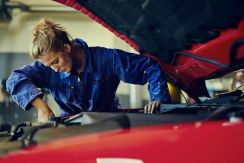 Mechanic performing car service